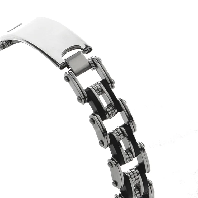Armband i rostfritt stål. 12mm tuff silver svart kedjedesign. Graverbar platta.