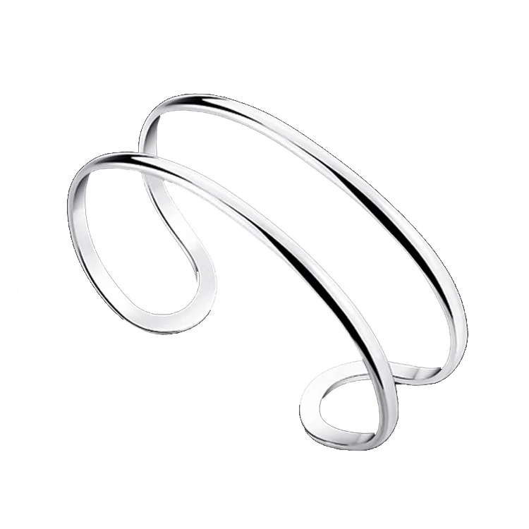 Silverarmband, 2cm bred. Luftigt formgivet med två linjer. På köpet: Justerbar ring i samma stil.
